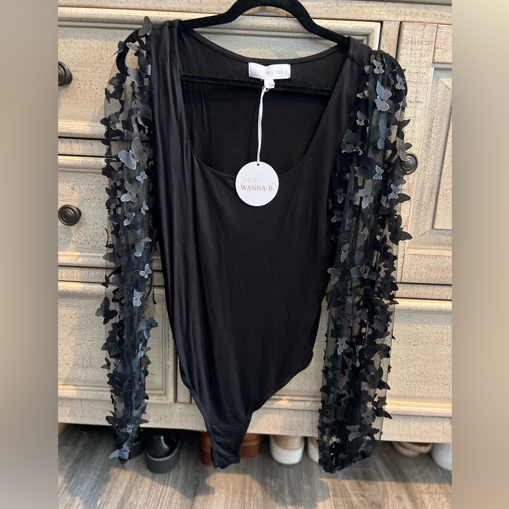 Wanna B size small, brand new never worn, body suit with butterflies.
